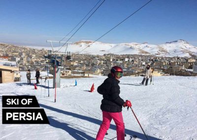 A woman skiing in Bijar ski resort Iran