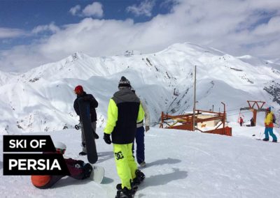Four snowboarders hitting the slope at Shemshal ski resort